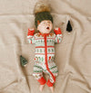 Baby in beanie with christmas jammies