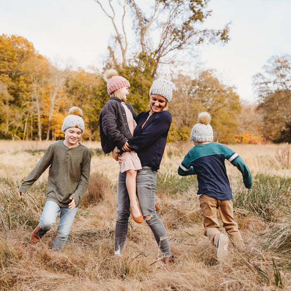 Brooke Happe owner of behappe and kids wearing beanies running around