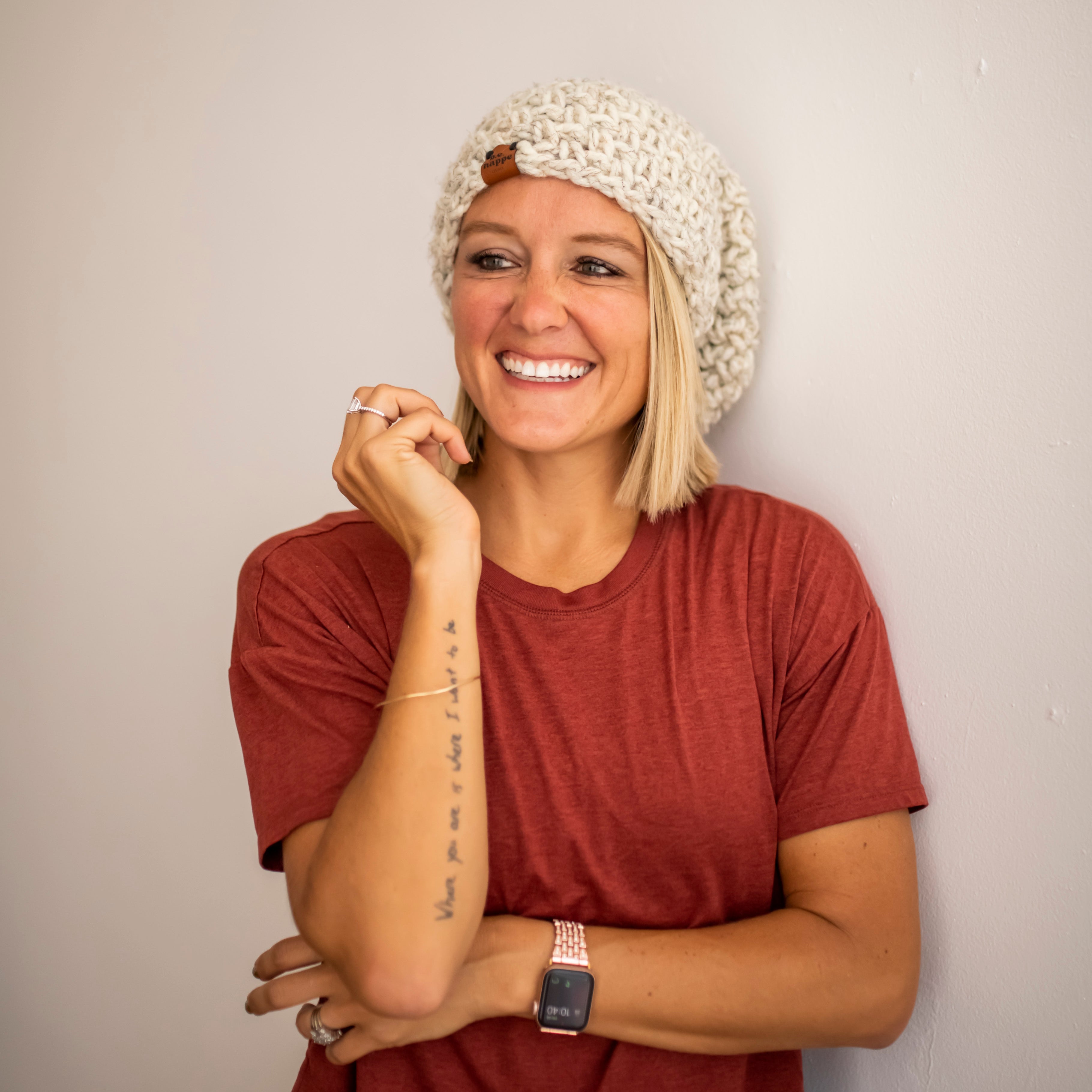 Brooke Happe wearing a natural colored women's slouchy beanie with tee