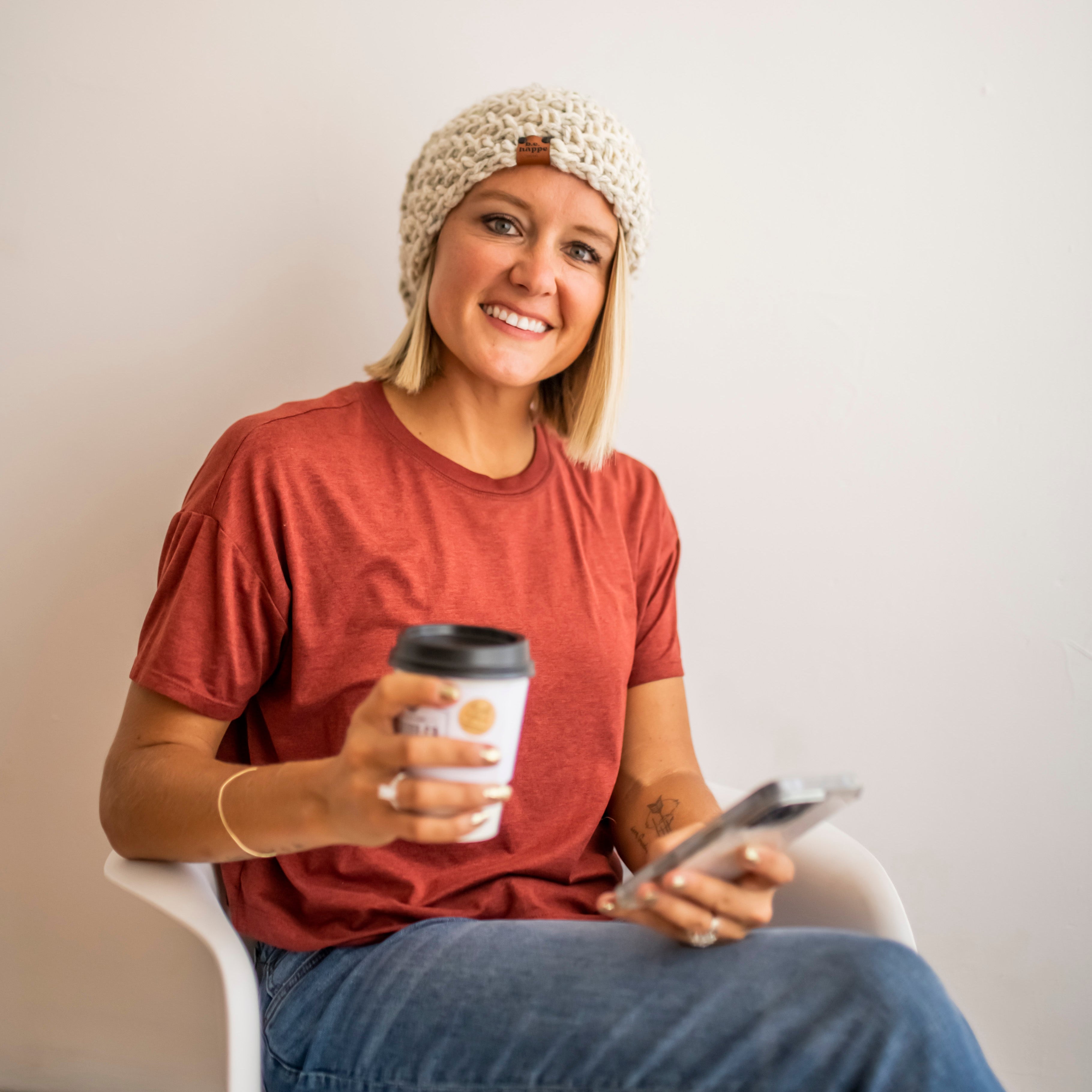 Brooke Happe wearing a natural colored women's slouchy beanie with tee