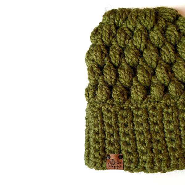 Cilantro green slouchy beanie with a thick band and puff stitch design, displayed on a white background.